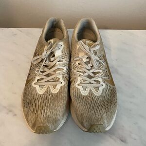 Gold Nike tennis shoes